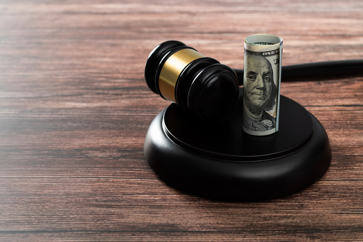 alimony lawyer - gavel with roll of money